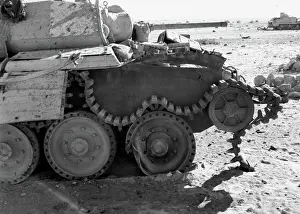 Print of a tank with broken track in desert landscape