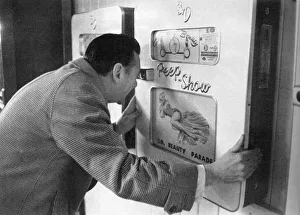 Robin Maugham looking at a peep-show in Brighton Robin Maugham looking at a peep-show in Brighton