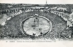 Roman Amphitheatre at Nimes, France - Bullfight. Built around 70 CE Roman Amphitheatre at Nimes, France - Bullfight. Built around 70 CE