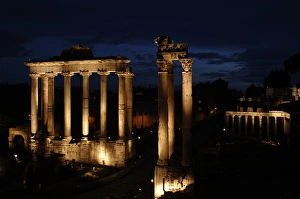 Rome. Roman Forum. Night view of the Temple of Saturn and Te Rome. Roman Forum. Night view of the Temple of Saturn and Te