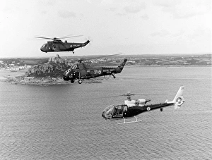 Three Royal Navy helicopters alongside St Michaels Mount Three Royal Navy helicopters alongside St Michaels Mount