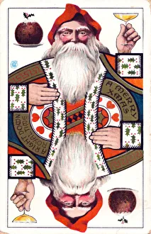 Santa Claus playing card on a Christmas postcard Santa Claus playing card on a Christmas postcard