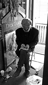 Seated artisan working on an object, England Seated artisan working on an object, England
