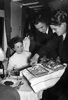 Silver Service on a Train: A 1940s Print of Fine Dining