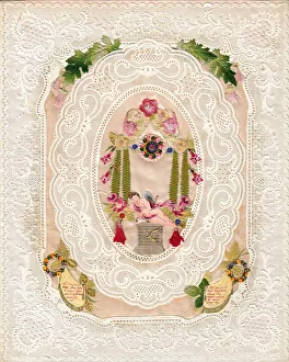 Sleeping cupid with flowers on a paper lace romantic card Sleeping cupid with flowers on a paper lace romantic card