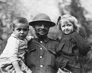 Soldier with two refugee children, Tournai, Flanders, WW1 Soldier with two refugee children, Tournai, Flanders, WW1