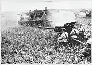 Prints of A Soviet T-34 tank passing a 76.2mm field gun Historical Event Prints: Soviet T-34 Tank and 76.2mm Field Gun Print