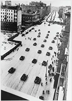 Prints of Tanks leave Moscow after a parade, going straight to the front-line. This is a view of Gorky Street Historical Event Prints: Soviet Tank Parade Print: Tanks Depart Gorky Street