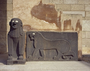 Sphinx and a lion in relief. Basalt. Syria Sphinx and a lion in relief. Basalt. Syria