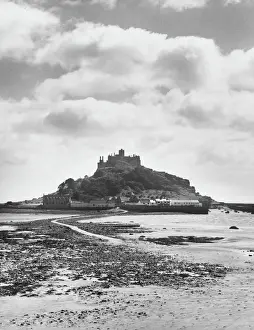 Prints of St. Michaels Mount, Cornwall, England. Edward the Confessor granted it to the Benedictine monks, who built an Abbey and a Priory on the summit Mount Prints: St. Michaels Mount Print: Benedictine Monastery, Cornwall, England