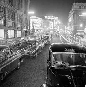 Stationary traffic along a busy Piccadilly at night Stationary traffic along a busy Piccadilly at night