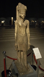 Statue of god Amun with factions of the Pharaoh Tutankhamun Statue of god Amun with factions of the Pharaoh Tutankhamun