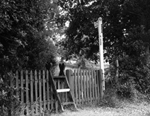 Prints of A curious step ladder stile next to a sign post, near Dedham, Essex, England. Date: 1930s Dedham Prints: Step-Ladder Stile Print, Dedham, Essex, England 1930s