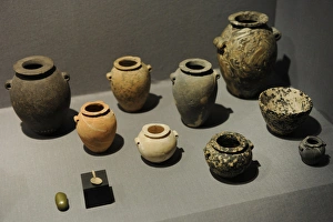 Stone jars and bowls with a small spoon and a small grinding Stone jars and bowls with a small spoon and a small grinding