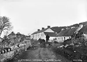 Prints of Straidkilly, Carnlough, The Slipping Village - a view of Straidkilly with a man driving on the road with a horse and cart. There is a thatched cottage on the right County Antrim Prints: Early 20th Century Print of Straidkilly, Carnlough