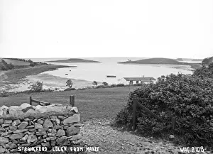 Prints of Strangford Lough from Mahee - a view over the Lough from Mahee with a wooden building on the foreshore. (Location: Northern Ireland; County Down; Mahee Island). Date: circa early 1900s Down Prints: Early 20th Century Print of Mahee Island Strangford Lough