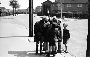 Street telephone fire alarm with group of children Street telephone fire alarm with group of children