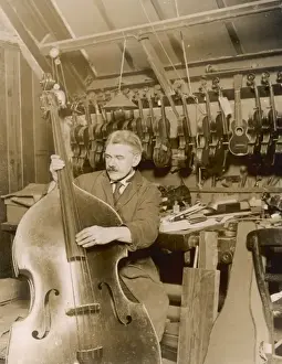 Stringed Instrument Maker Prints: Stringed instrument maker in his workshop