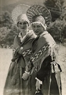 Two Swiss girls wearing traditional Zurich peasant costumes including shawls Two Swiss girls wearing traditional Zurich peasant costumes including shawls