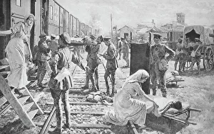 Taking the wounded aboard a British ambulance Taking the wounded aboard a British ambulance