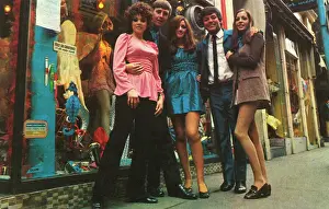 Prints of A group of groovy people posed outside a boutique in Carnaby Street, London, including radio DJ Tony Blackburn. Date: 1967 Fashion Prints: Tony Blackburn with Groovy Things, Carnaby Street Print 1967