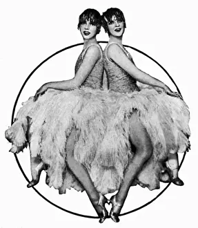 Prints of Cabaret entertainers the Tosh Sisters from Vienna - amusing the patrons of West End clubs in London in 1929. Pictured here in feather-skirted costumes. Date: 1929 Vienna Prints: 1929 Print of the Tosh Sisters in Feather-Skirted Costumes