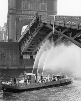 Prints of Tower Bridge, London, jams when the metal expands in the summer heat on 2 July 1968. The bridge is closed for two hours while firefighters cool it down with their hoses Bridge Prints: Tower Bridge, London: Summer Heat Jam 1968 Print