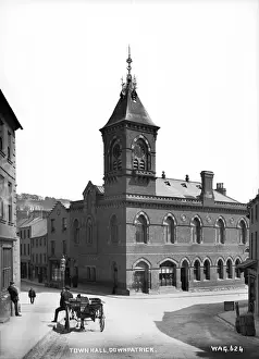Prints of Town Hall, Downpatrick - view with man and horse vehicle in front. (Location: Northern Ireland: County Down: Downpatrick). Date: circa early 1900s Down Prints: Downpatrick Town Hall Print, Northern Ireland, Early 1900s