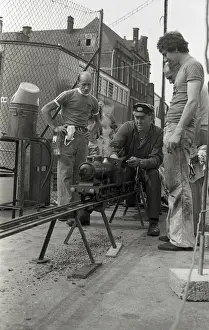 Railway Transport Prints: Train driver prepares engine on model steam train