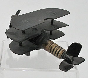 Trench Art triplane - a sparkplug fuselage and metal wings Trench Art triplane - a sparkplug fuselage and metal wings