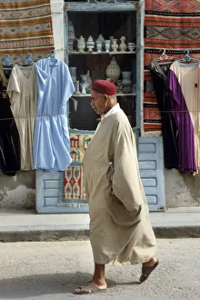 A Tunisian man wearing a djelleba and a chechia hat A Tunisian man wearing a djelleba and a chechia hat