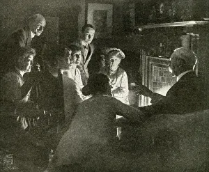 Typical English family gathered around the fireside Typical English family gathered around the fireside