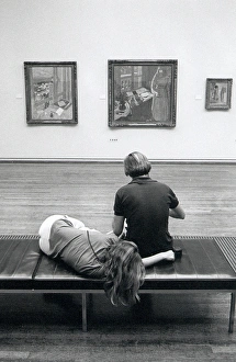 Visitors resting in The Tate Gallery, London Visitors resting in The Tate Gallery, London
