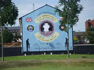 Prints of Belfast. Wall mural of the Military Commander and West Belfast Brigade in the end corner of the terrace house. Date: 2011 Belfast Prints: West Belfast Brigade Military Commander Print 2011