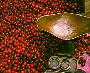 Weighing scales and cherries, London market stall Weighing scales and cherries, London market stall
