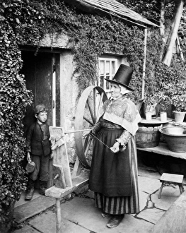 Welsh woman with spinning wheel, Wales Welsh woman with spinning wheel, Wales
