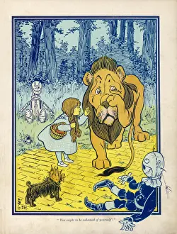Dorothy scolds the Cowardly Lion in a Mary Evans Print