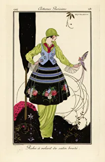 Woman in pea-green dress with embroidered satin skirt Woman in pea-green dress with embroidered satin skirt
