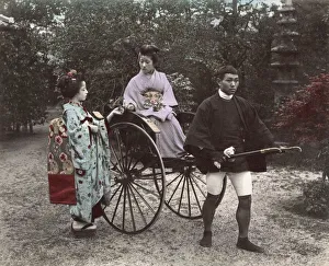 Woman being pulled in rickshaw, jinrikisha, Japan Woman being pulled in rickshaw, jinrikisha, Japan