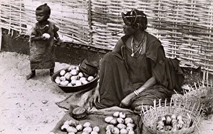 Woman selling Mangoes on the street - Dakar, Senegal Woman selling Mangoes on the street - Dakar, Senegal