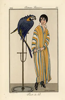 Woman in striped nightgown with pet parrot Woman in striped nightgown with pet parrot