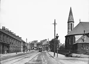 Prints of Woodvale Road, Belfast - a view down the road with a Church on the right and a tram visible. (Location: Northern Ireland: County Antrim: Belfast). Date: circa early 1900s Northern Ireland Prints: Early 20th Century Print of Woodvale Road, Belfast