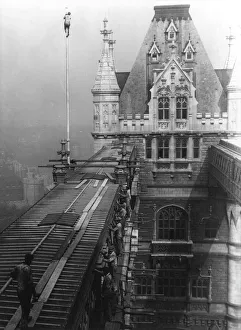 Workmen repairing part of the walkways on Tower Bridge Workmen repairing part of the walkways on Tower Bridge