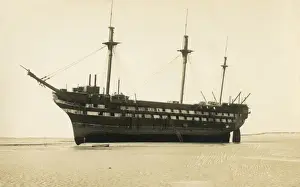 Prints of Wreck of a Ship of the Line - beached near Bideford, Devon Date: circa 1910s Bideford Prints: Wreck of a Ship of the Line Print, circa 1910s