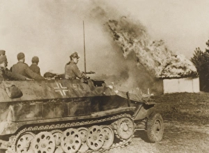WW2 - German tank driving through a burning Russian village WW2 - German tank driving through a burning Russian village