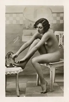 Young Lady doing a pedicure on herself Young Lady doing a pedicure on herself