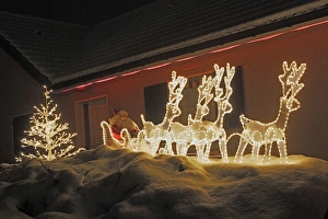 Christmas Decorations - illuminated reindeer & sleigh outside house Christmas Decorations - illuminated reindeer & sleigh outside house