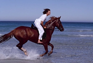 Girl rides HORSE - galloping along sea edge Girl rides HORSE - galloping along sea edge