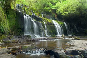 Purakaunui Falls - beautiful waterfall within dense temperate rainforest Purakaunui Falls - beautiful waterfall within dense temperate rainforest