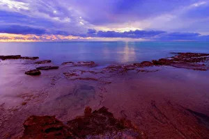 Sunset over the Reef - colourful sunset over Ningaloo Reef and the ocean Sunset over the Reef - colourful sunset over Ningaloo Reef and the ocean